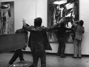 Oswaldo Vigas working on the assembly of his exhibition Oswaldo Vigas, imagen de una identidad expresiva, Italian Art Museum of Lima, Peru, 1977