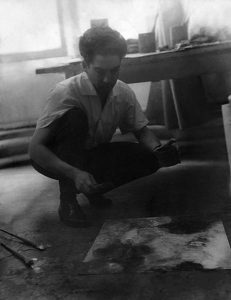 Oswaldo Vigas painting in his studio at Hotel D'Aubusson, Paris, 1960s