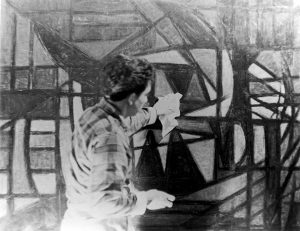 Oswaldo Vigas working on his artwork Objeto Mágico in his studio in Paris, 1955