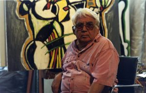 Oswaldo Vigas in his studio in Los Dos Caminos painting one of his healers, 2012